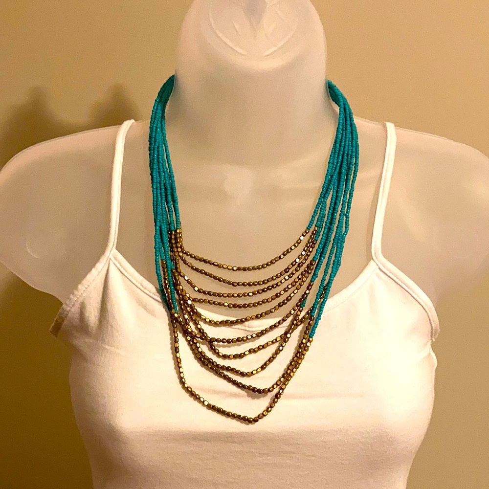 Turquoise and gold multi strand statement necklace